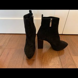 Saint Laurent Black heeled suede designer boots.